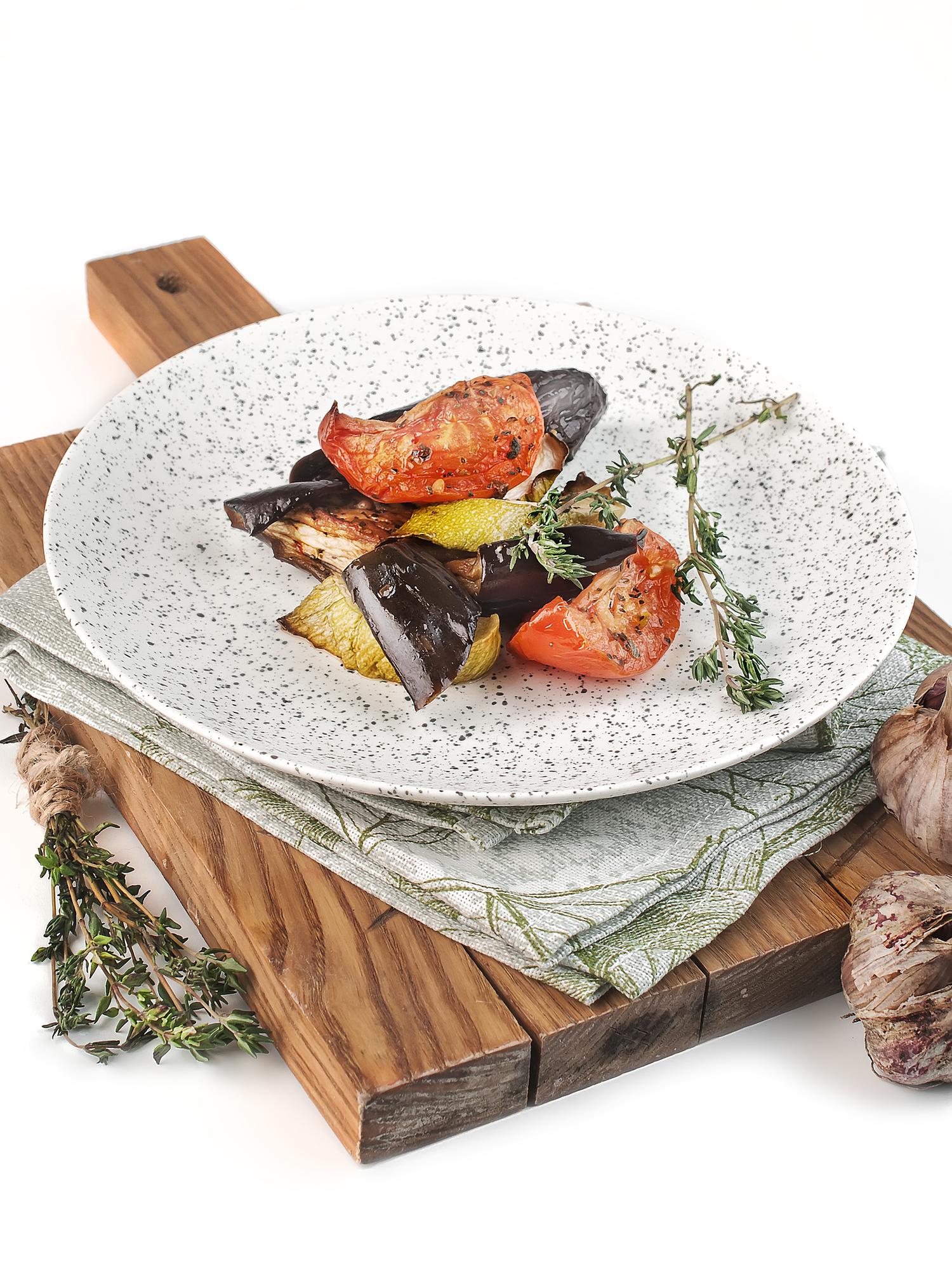 Close-up of plated seasonal dish on a dark table